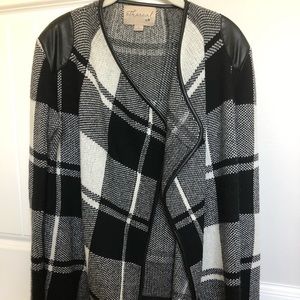 black and white sweater with leather